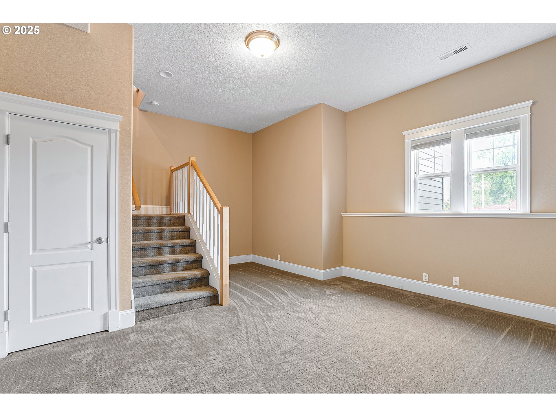 2947 Southeast Maple Place Gresham, OR 97080 - Photo 38 of 46 an empty room with wooden floor and windows