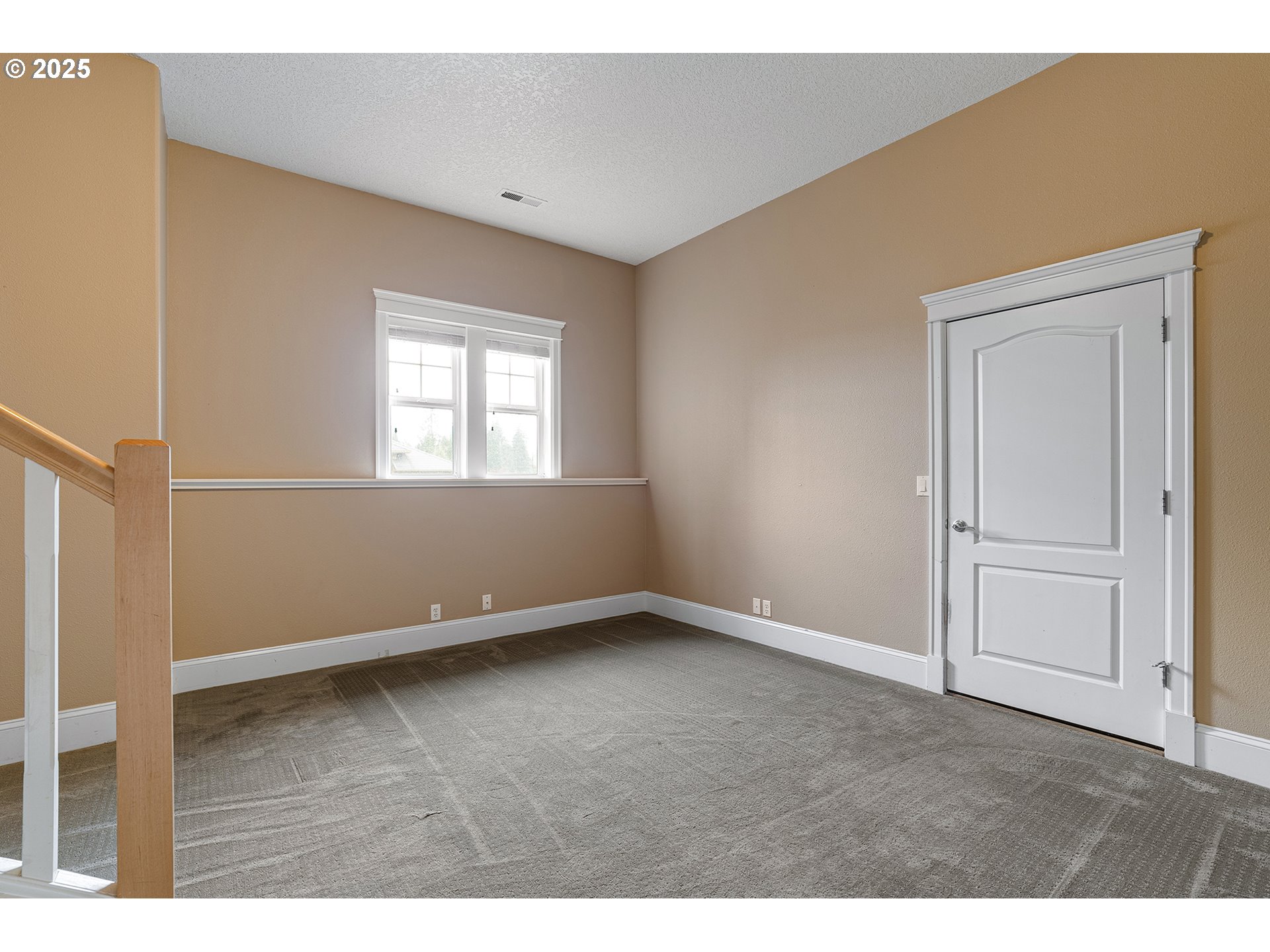 2947 Southeast Maple Place Gresham, OR 97080 - Photo 39 of 46 a view of an empty room with wooden floor and a window