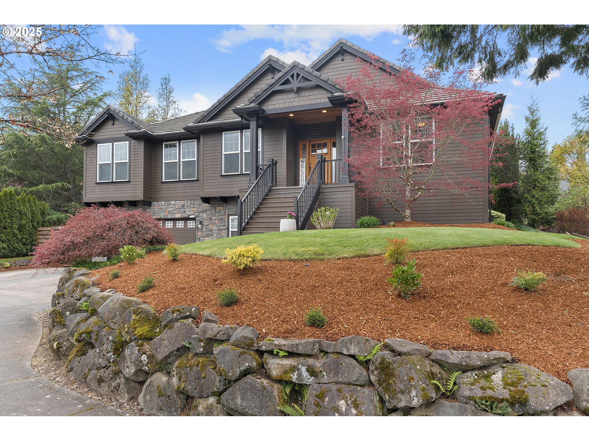 2947 Southeast Maple Place Gresham, OR 97080 - Photo 4 of 46 a front view of a house with a yard and garage