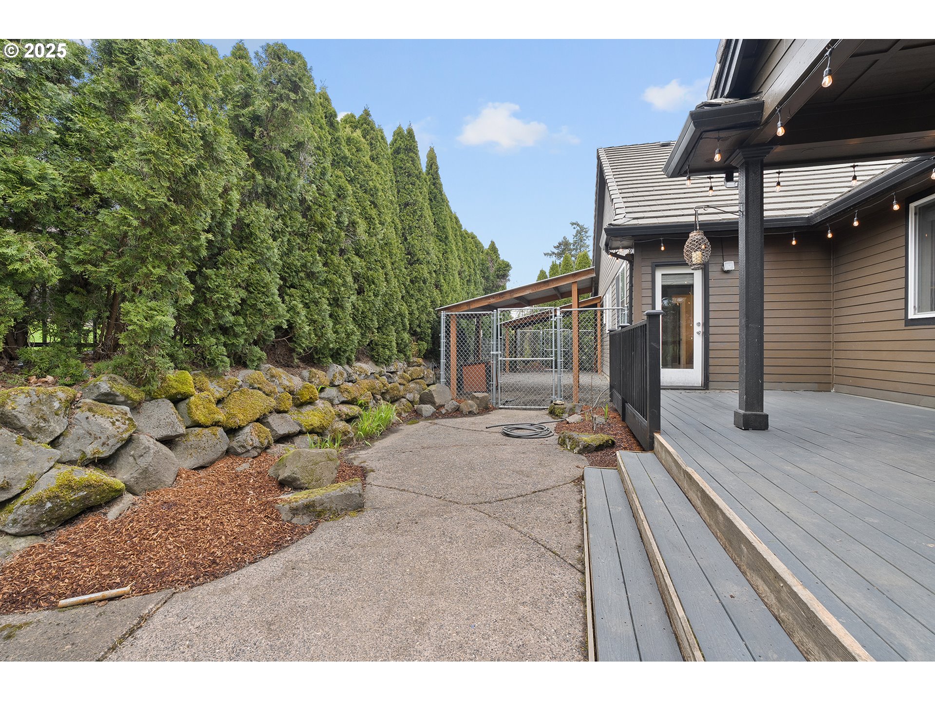 2947 Southeast Maple Place Gresham, OR 97080 - Photo 45 of 46 a view of a house with a patio