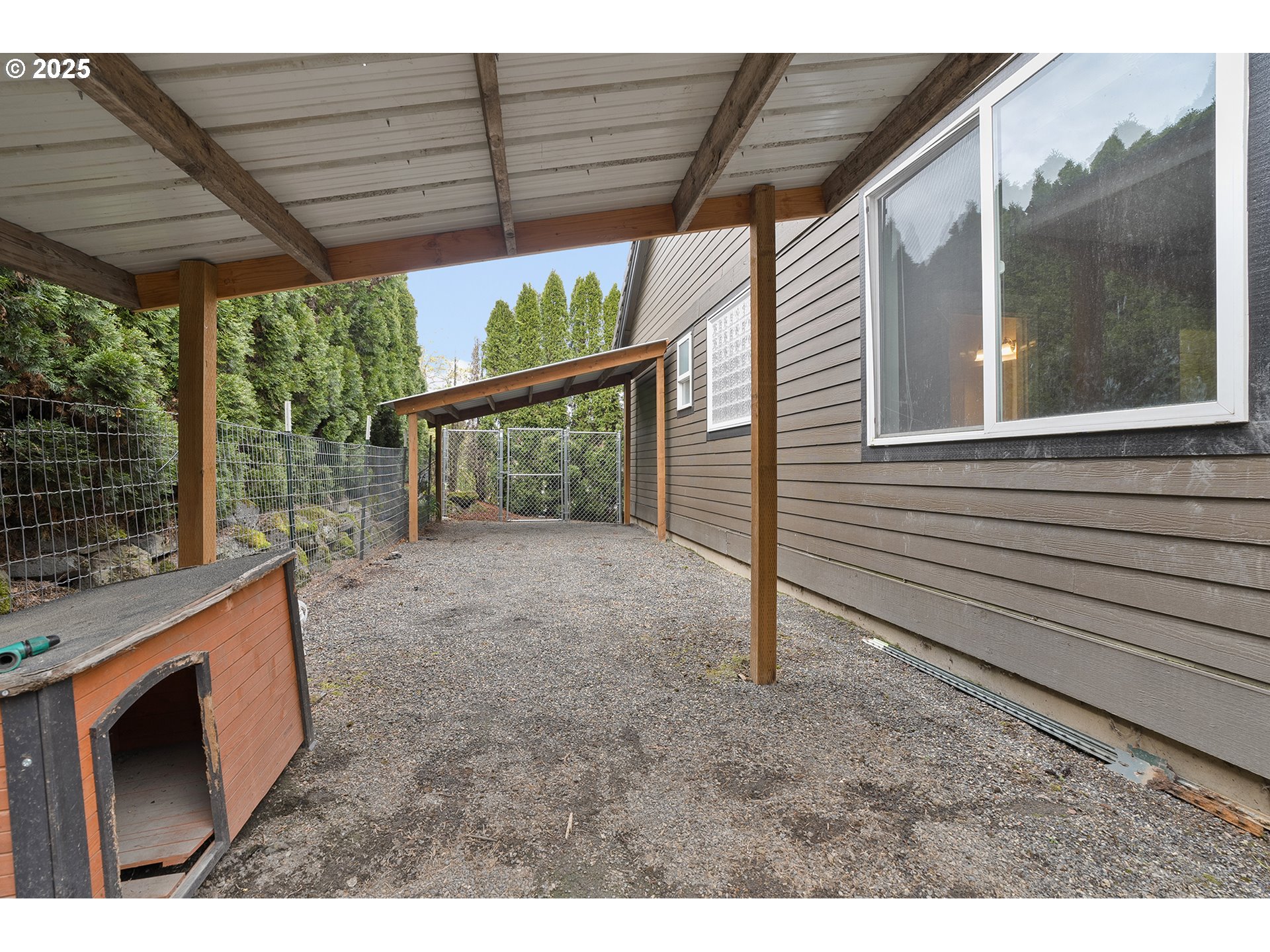 2947 Southeast Maple Place Gresham, OR 97080 - Photo 46 of 46 a view of a backyard with wooden fence and a porch