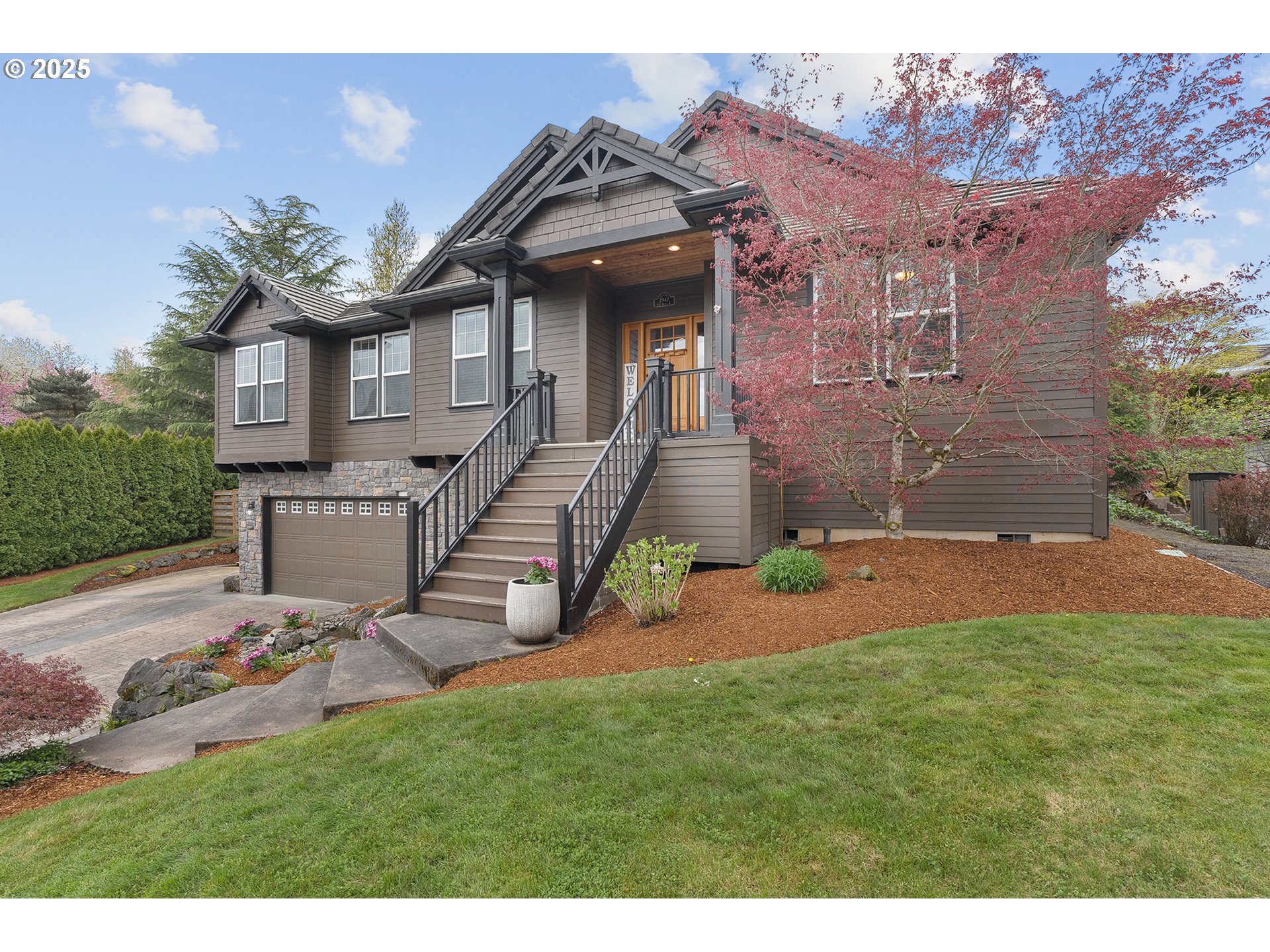 2947 Southeast Maple Place Gresham, OR 97080 - Photo 5 of 46 a view of a big house with a big yard and large tree