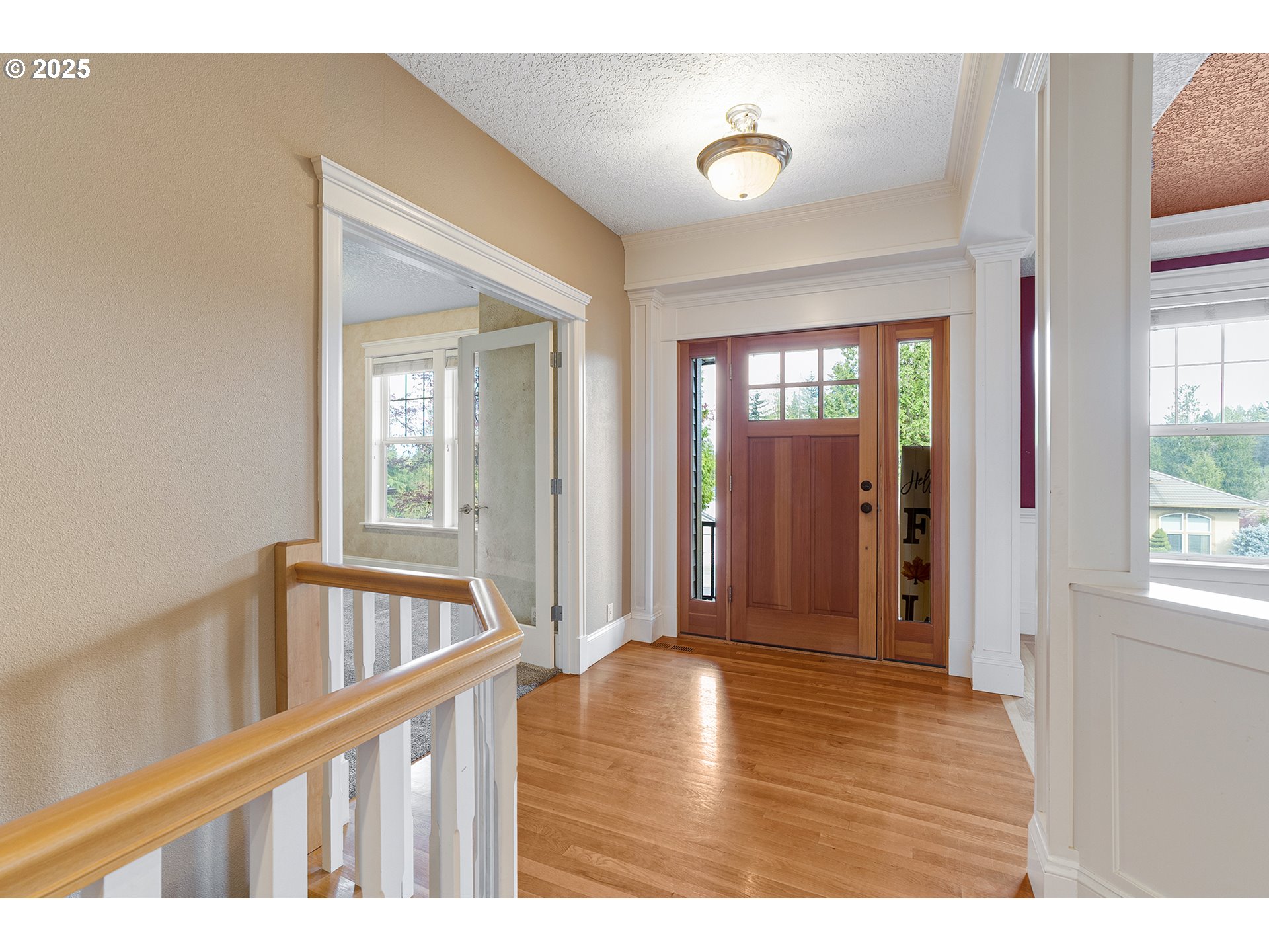 2947 Southeast Maple Place Gresham, OR 97080 - Photo 7 of 46 a view of an entryway with wooden floor