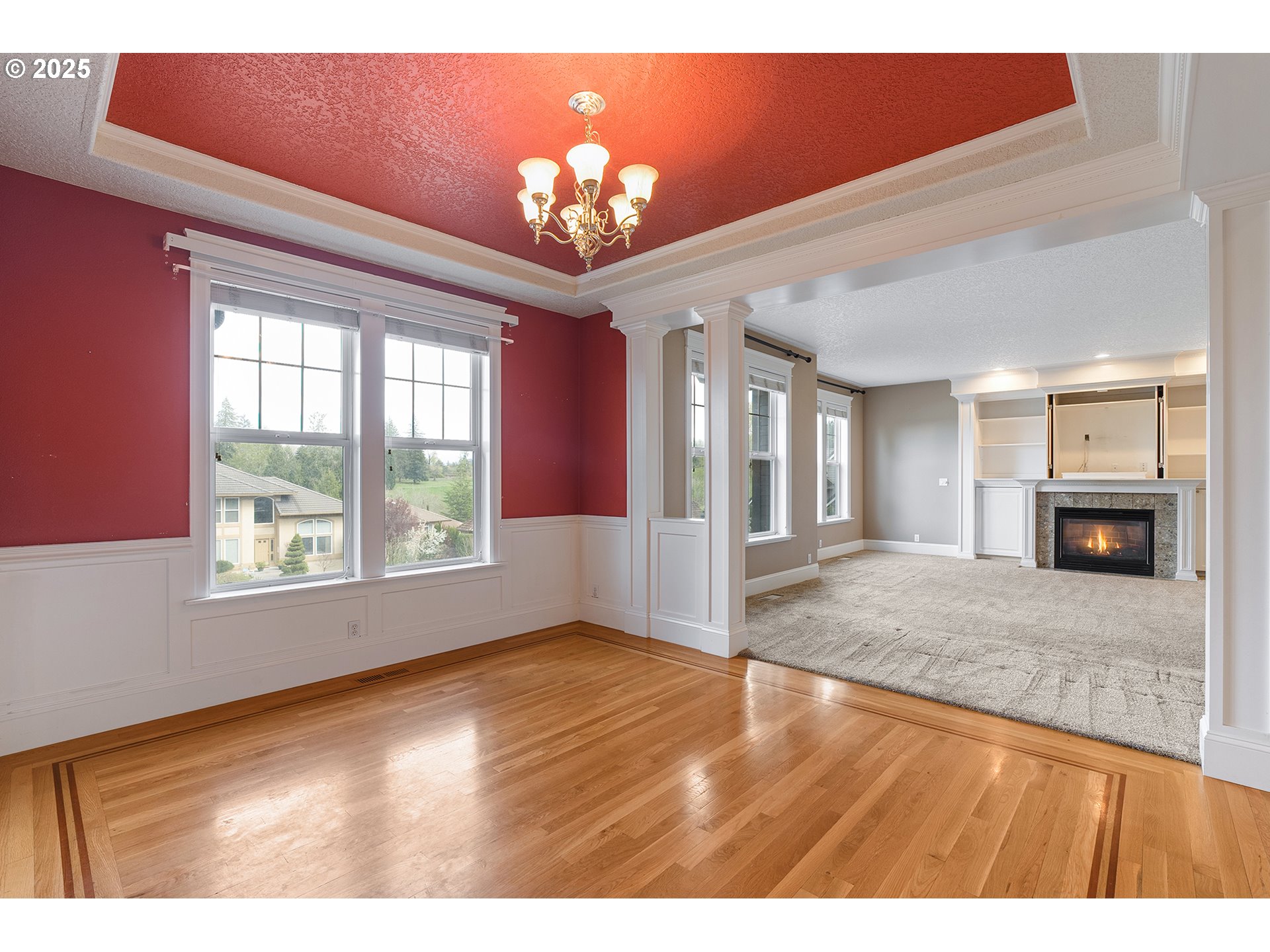2947 Southeast Maple Place Gresham, OR 97080 - Photo 10 of 46 a view of an empty room and chandelier fan and fire place