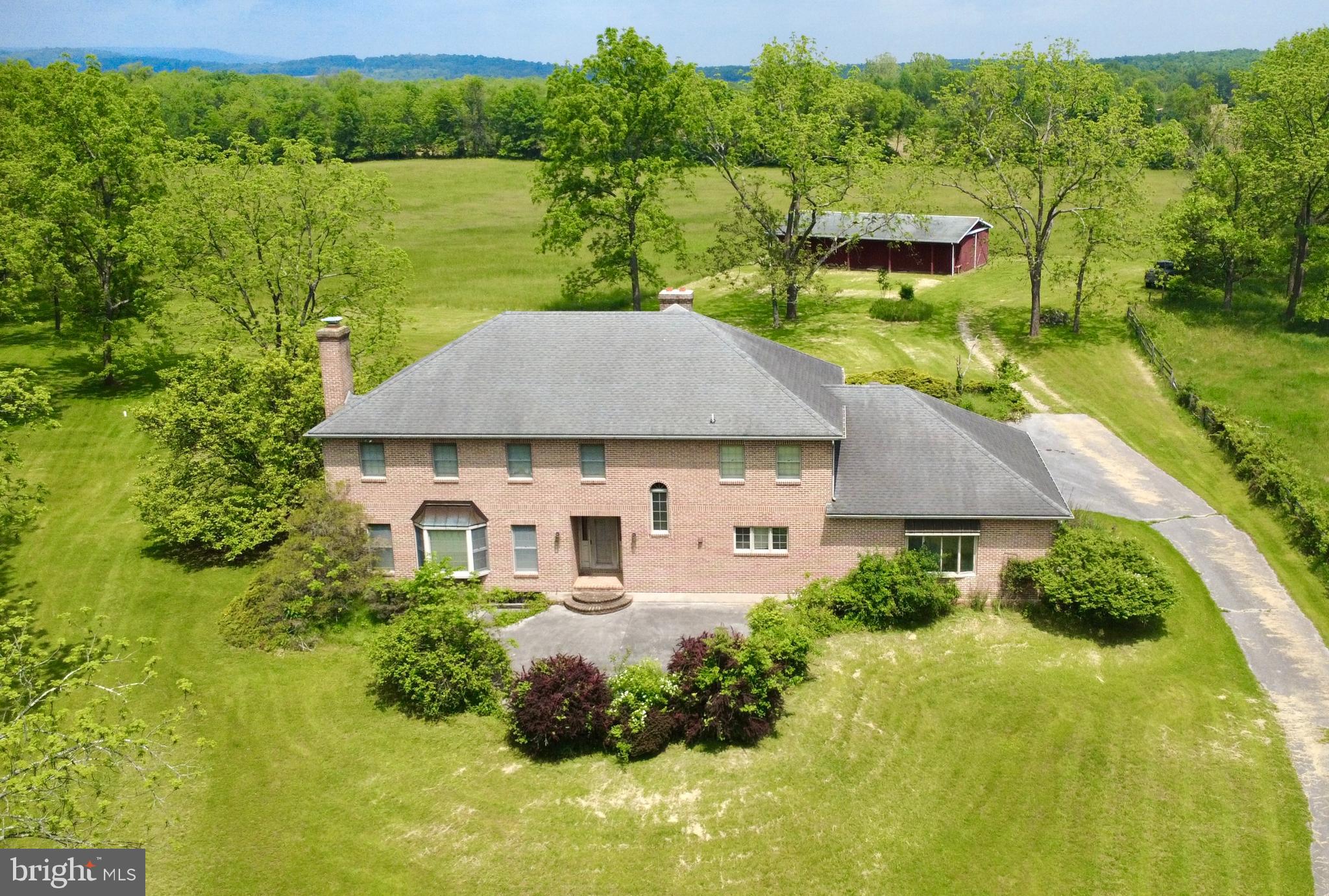 an aerial view of a house with a garden