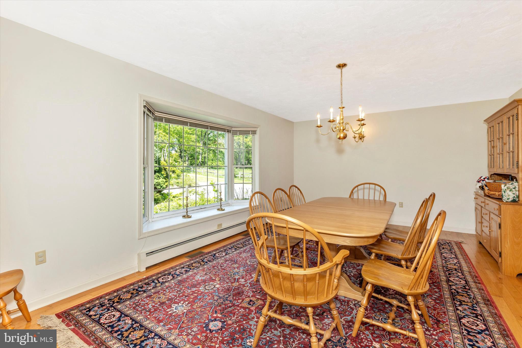 511 Stultz Road Fairfield, PA 17320 - Photo 28 of 86 a dining room with furniture a rug and a chandelier