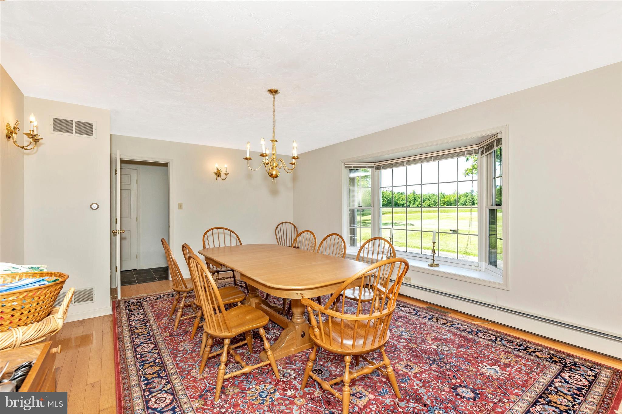511 Stultz Road Fairfield, PA 17320 - Photo 30 of 86 a dining room with furniture a rug and a chandelier