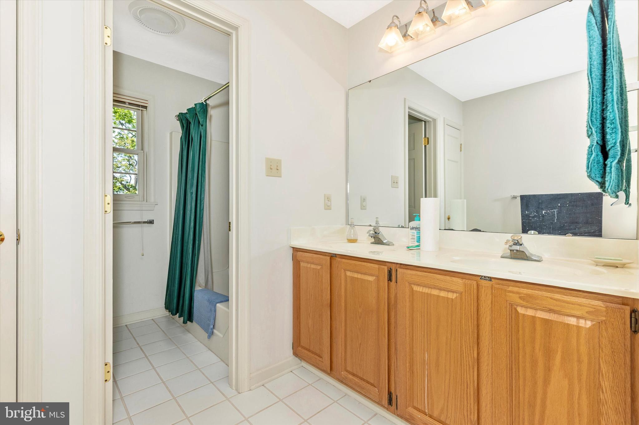 511 Stultz Road Fairfield, PA 17320 - Photo 51 of 86 a bathroom with a double vanity sink and a mirror