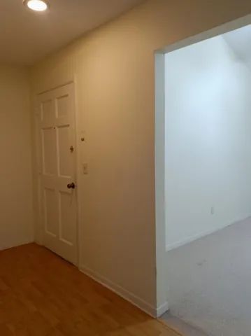 an empty room with closet area