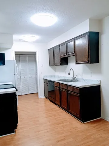 a view of a livingroom and a chandelier fan