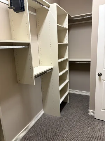 a view of an empty walk in closet