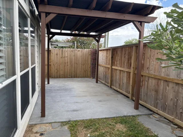 a view of small space with wooden fence