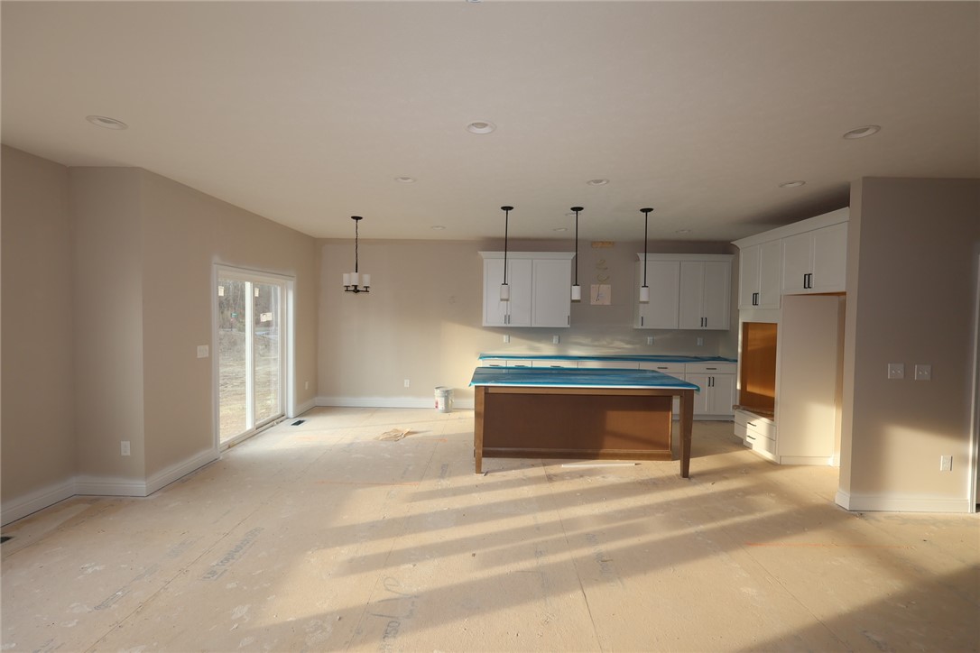 240 Tilly Court, Unit 5 Springboro, OH 45066 - Photo 11 of 26 This bright, open concept space features a kitchen island and recessed lighting, ready for personalization.
