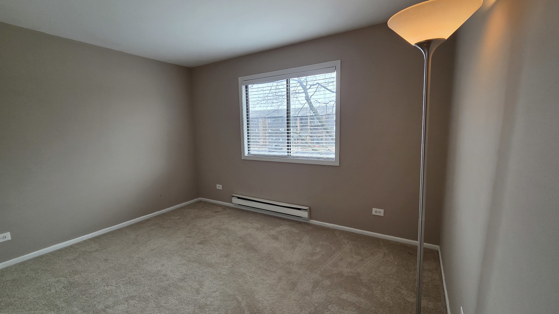627 South Virginia Road, Unit 212 Crystal Lake, IL 60014 - Photo 12 of 15 an empty room with a window