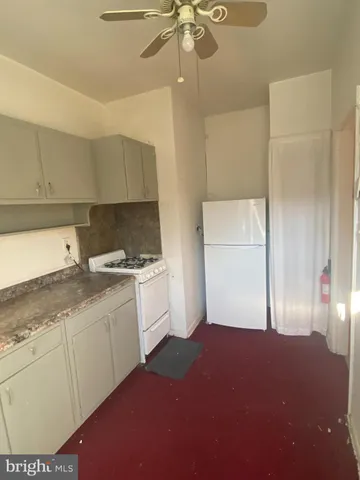 a kitchen with a sink cabinets and window