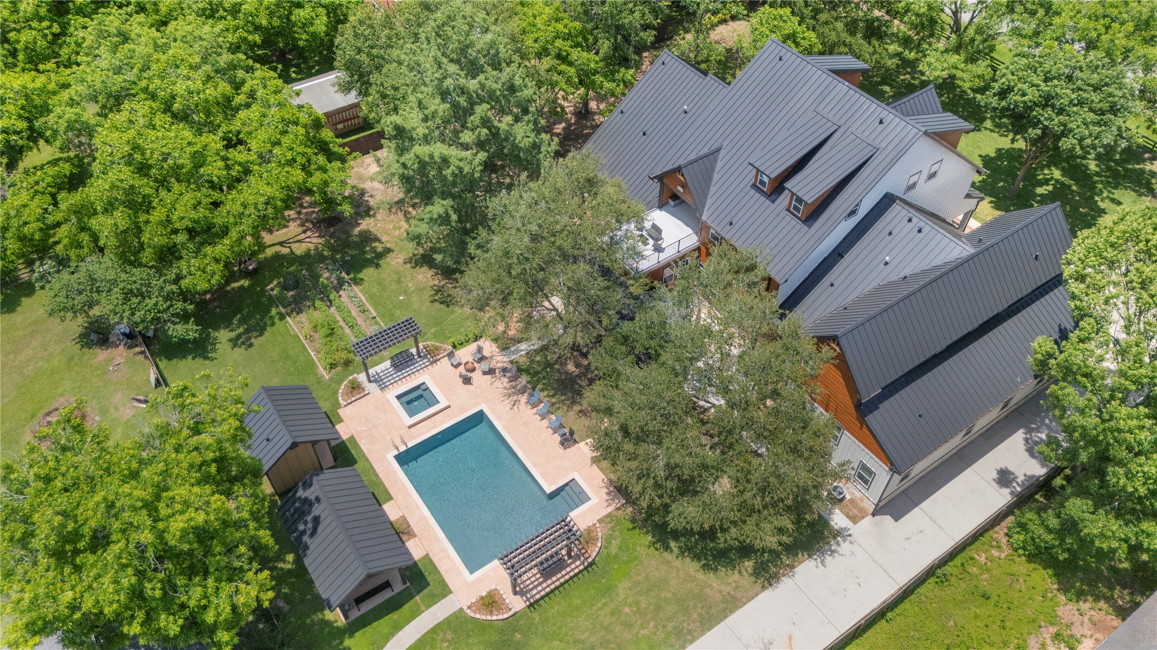 4607 Clayhead Road Richmond, TX 77406 - Photo 37 of 49 Striking overhead perspective highlighting the luxury pool, manicured landscape, and custom residence.