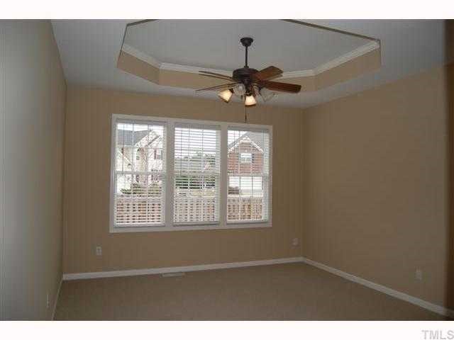 8620 Churchdown Court Raleigh, NC 27613 - Photo 7 of 12 a view of an empty room with a window