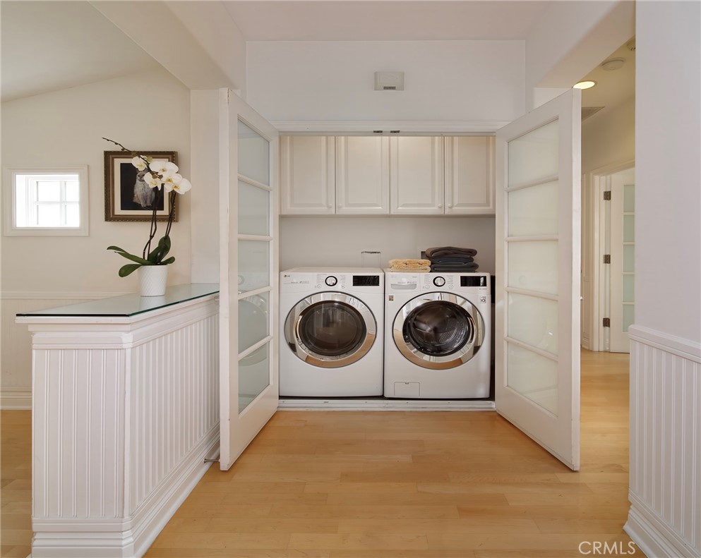 2741 Bungalow Place Corona del Mar, CA 92625 - Photo 13 of 29 a utility room with sink dryer and washer
