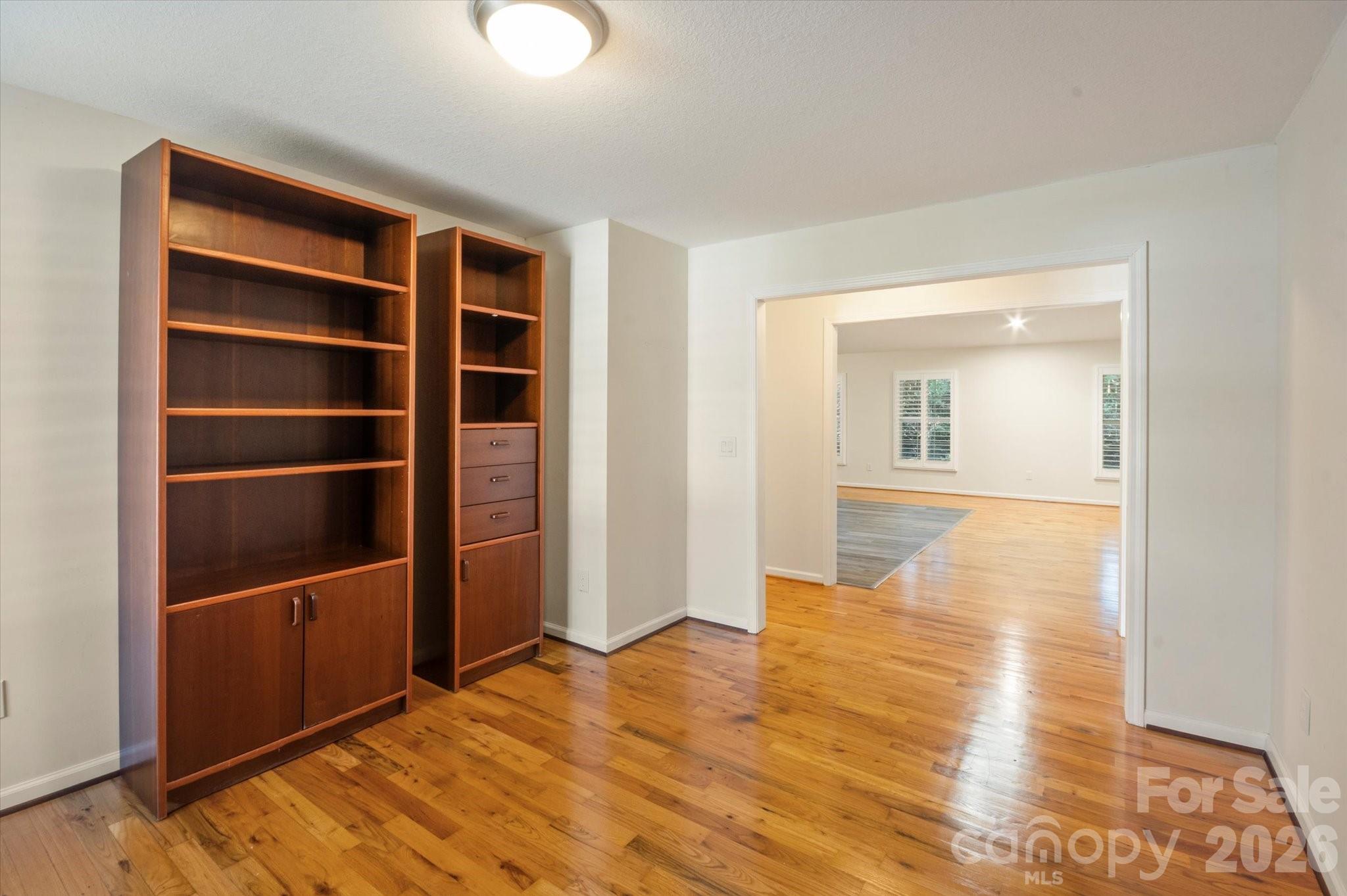 207 Allen Paul Road Hendersonville, NC 28791 - Photo 12 of 28 a view of an empty room with wooden floor and closet