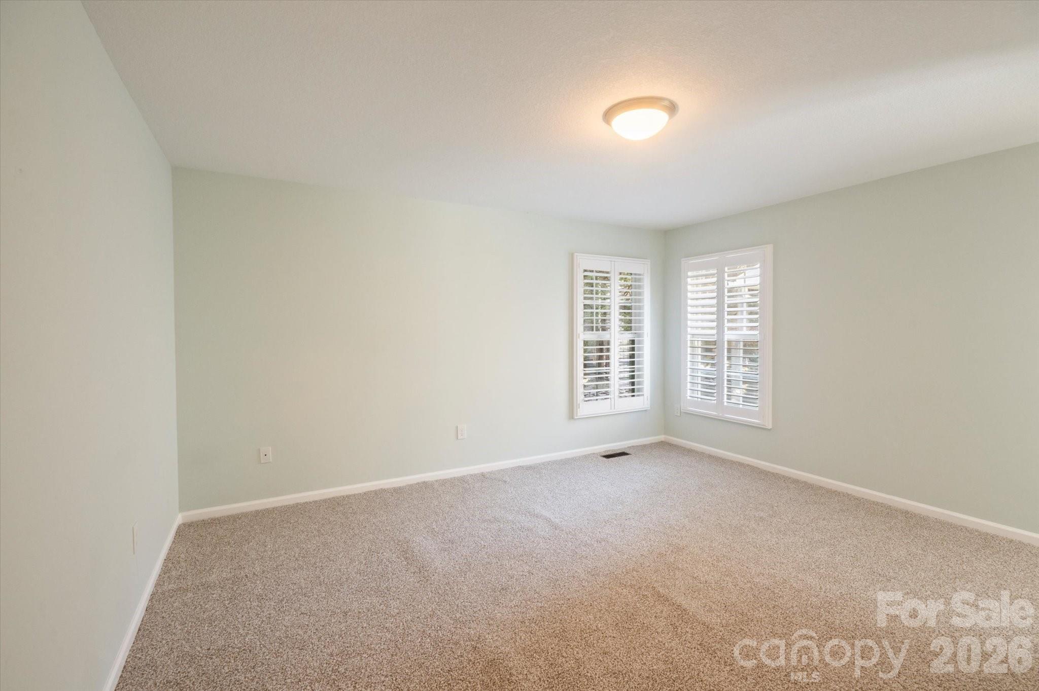 207 Allen Paul Road Hendersonville, NC 28791 - Photo 13 of 28 an empty room with windows