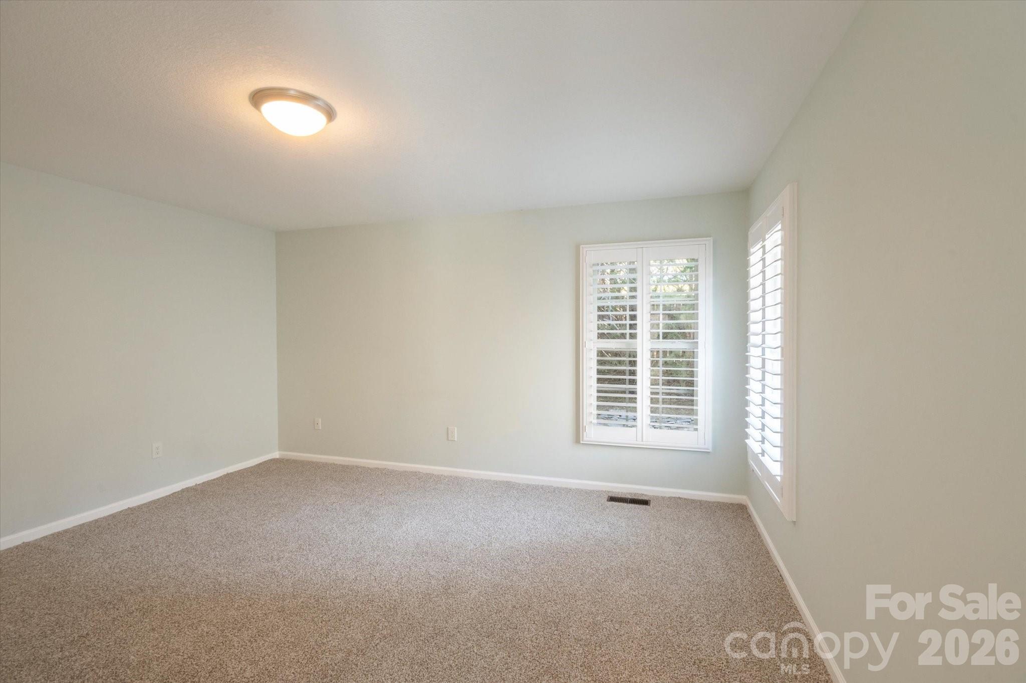 207 Allen Paul Road Hendersonville, NC 28791 - Photo 14 of 28 a view of an empty room with a window