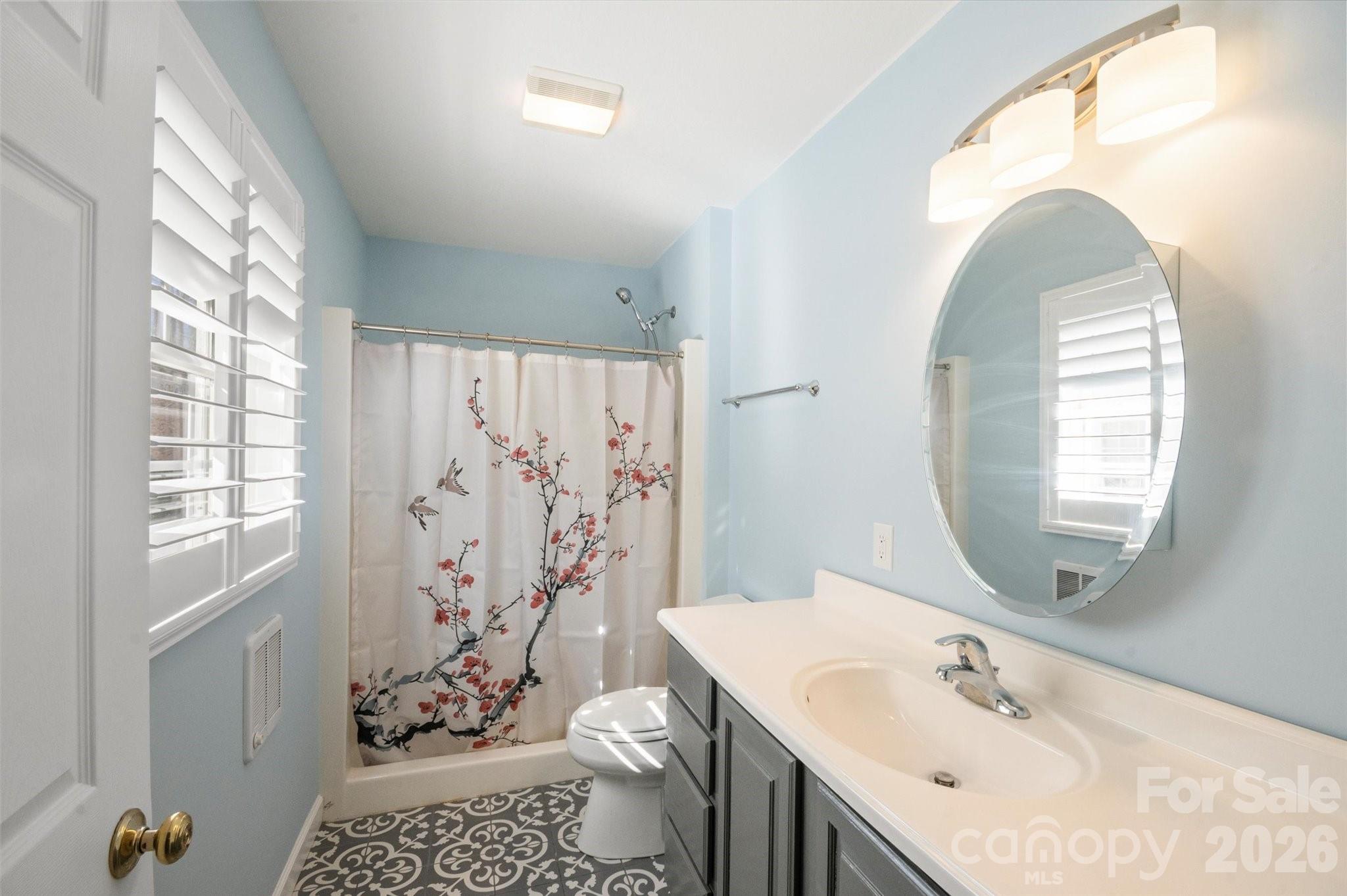207 Allen Paul Road Hendersonville, NC 28791 - Photo 17 of 28 a bathroom with a sink toilet and shower