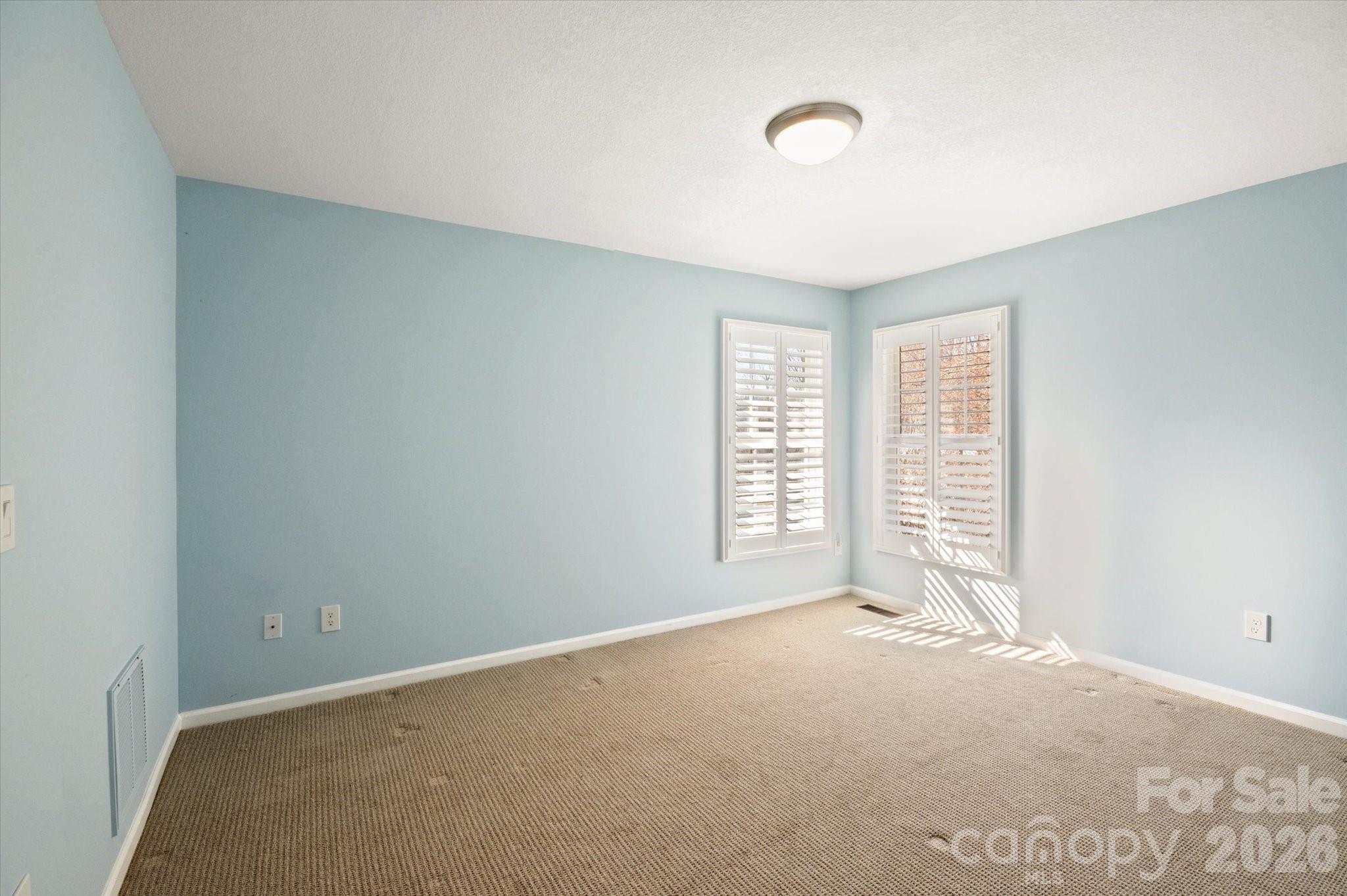 207 Allen Paul Road Hendersonville, NC 28791 - Photo 19 of 28 a view of an empty room with a window
