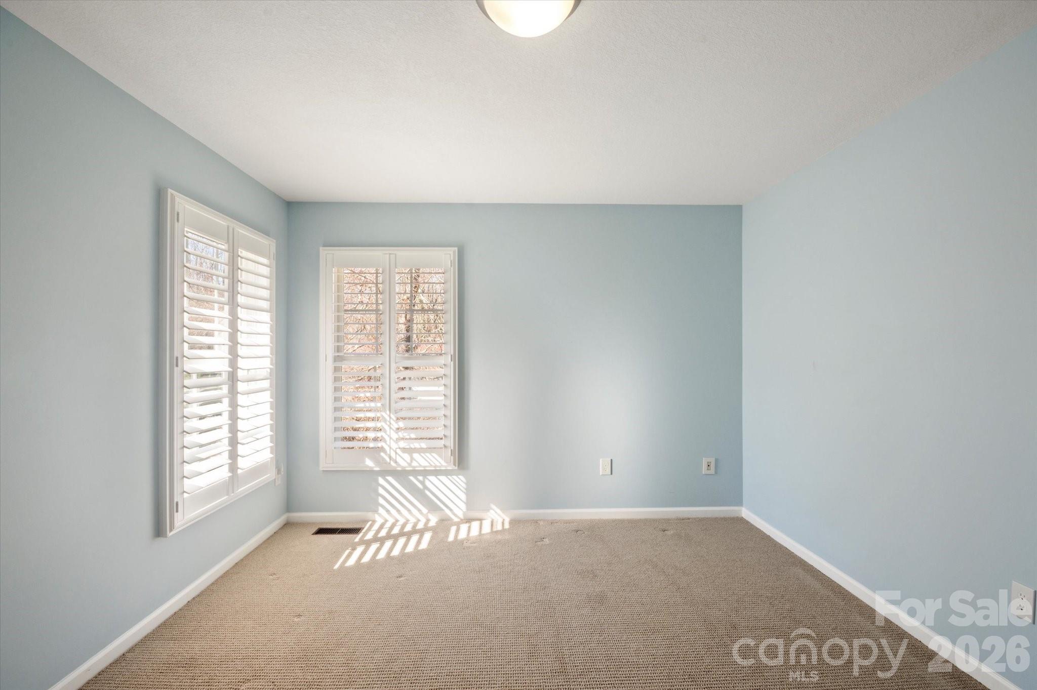 207 Allen Paul Road Hendersonville, NC 28791 - Photo 20 of 28 an empty room with windows