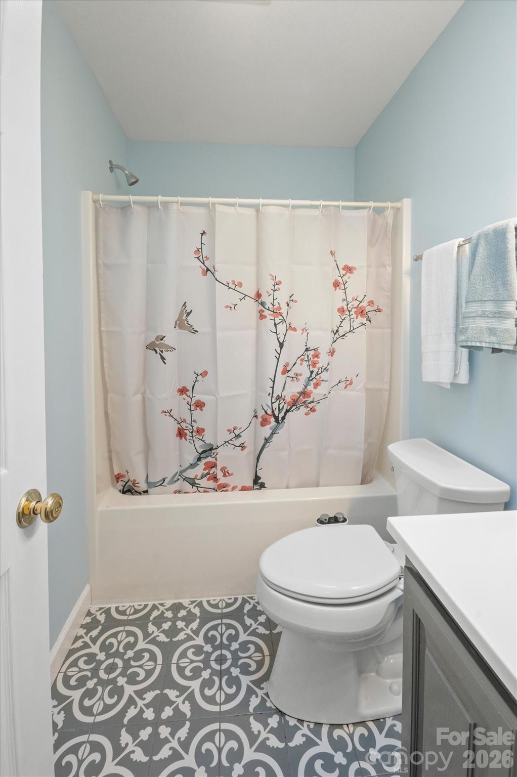 207 Allen Paul Road Hendersonville, NC 28791 - Photo 23 of 28 a white toilet sitting next to a bathroom sink