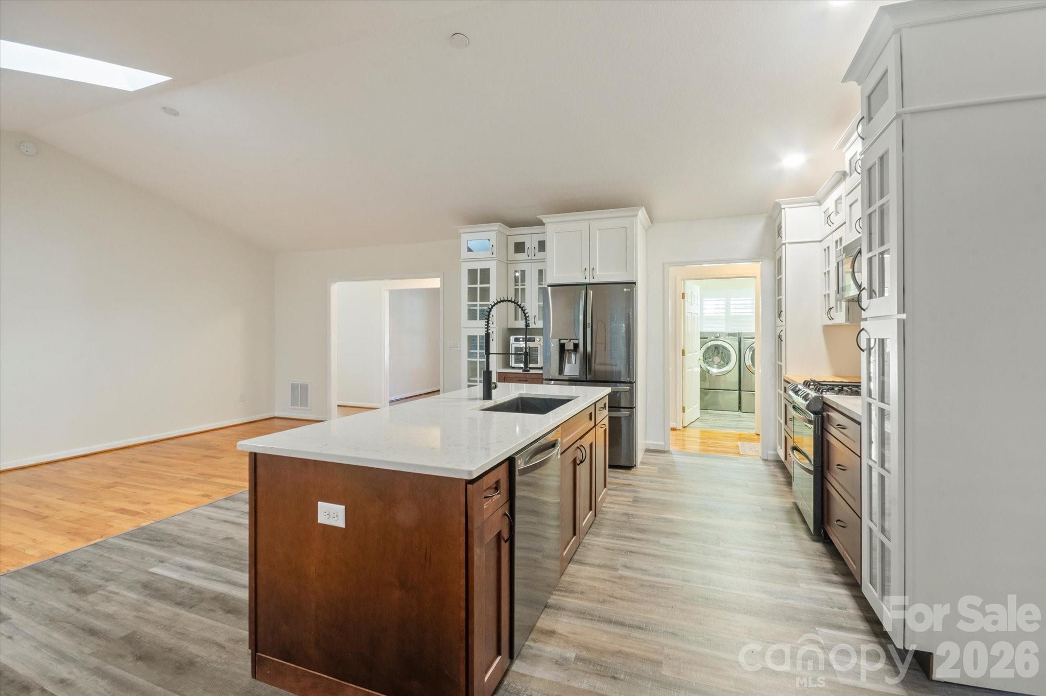 207 Allen Paul Road Hendersonville, NC 28791 - Photo 6 of 28 a kitchen with a sink stove and refrigerator