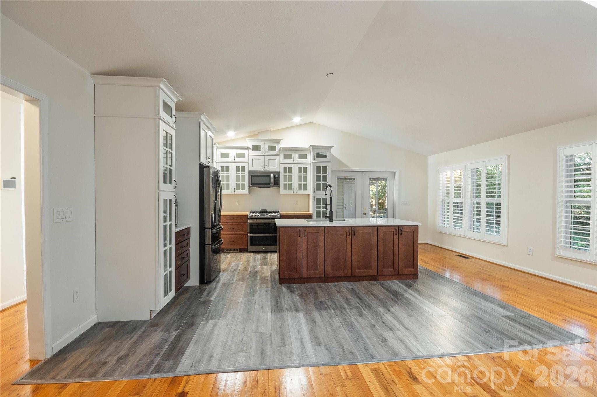 207 Allen Paul Road Hendersonville, NC 28791 - Photo 10 of 28 a living room with stainless steel appliances wooden floors and large window