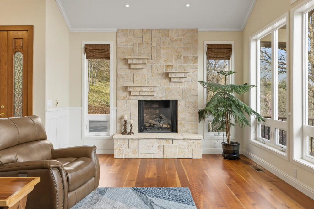 6586 Cooper's Hawk Road Klamath Falls, OR 97601 - Photo 12 of 68 a living room with furniture and a fireplace