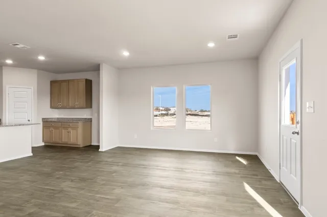 a view of an empty room with a window