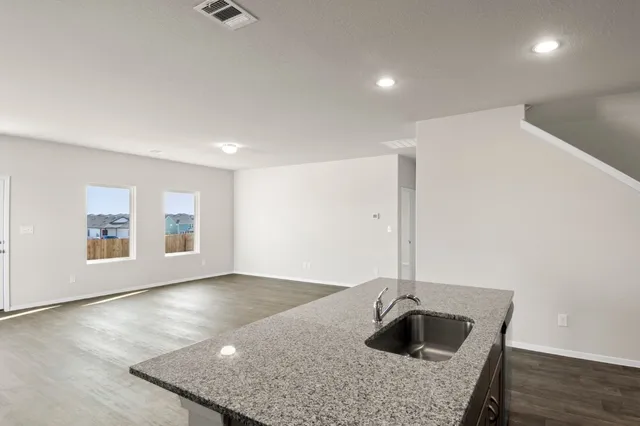 a view of a slide with iron fence