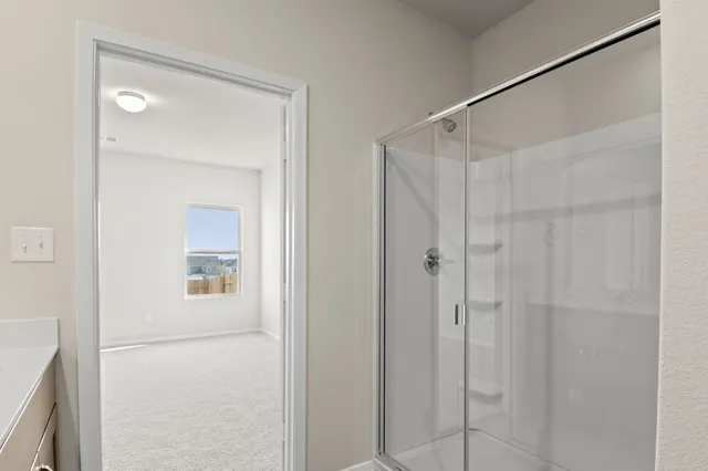 a view of an empty room and a window