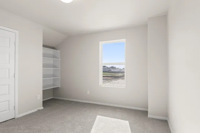 an empty room with a empty space and window