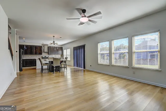 a view of a dining room with furniture window and wooden floor