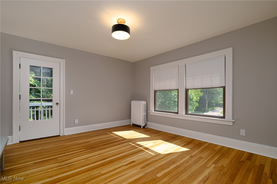 2624 Lee Road Cleveland, OH 44118 - Photo 29 of 50 unfurnished bedroom #3 with natural hardwood and large windows and door to balcony