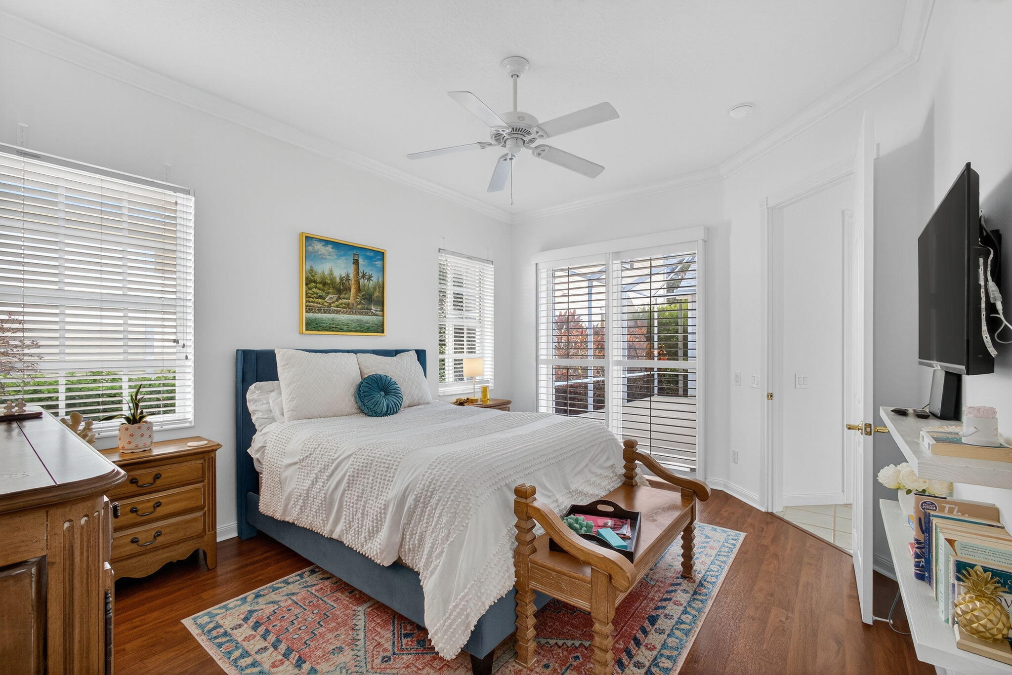 172 Queensland Lane Jupiter, FL 33458 - Photo 15 of 25 a bedroom with a bed and a flat tv screen on dresser