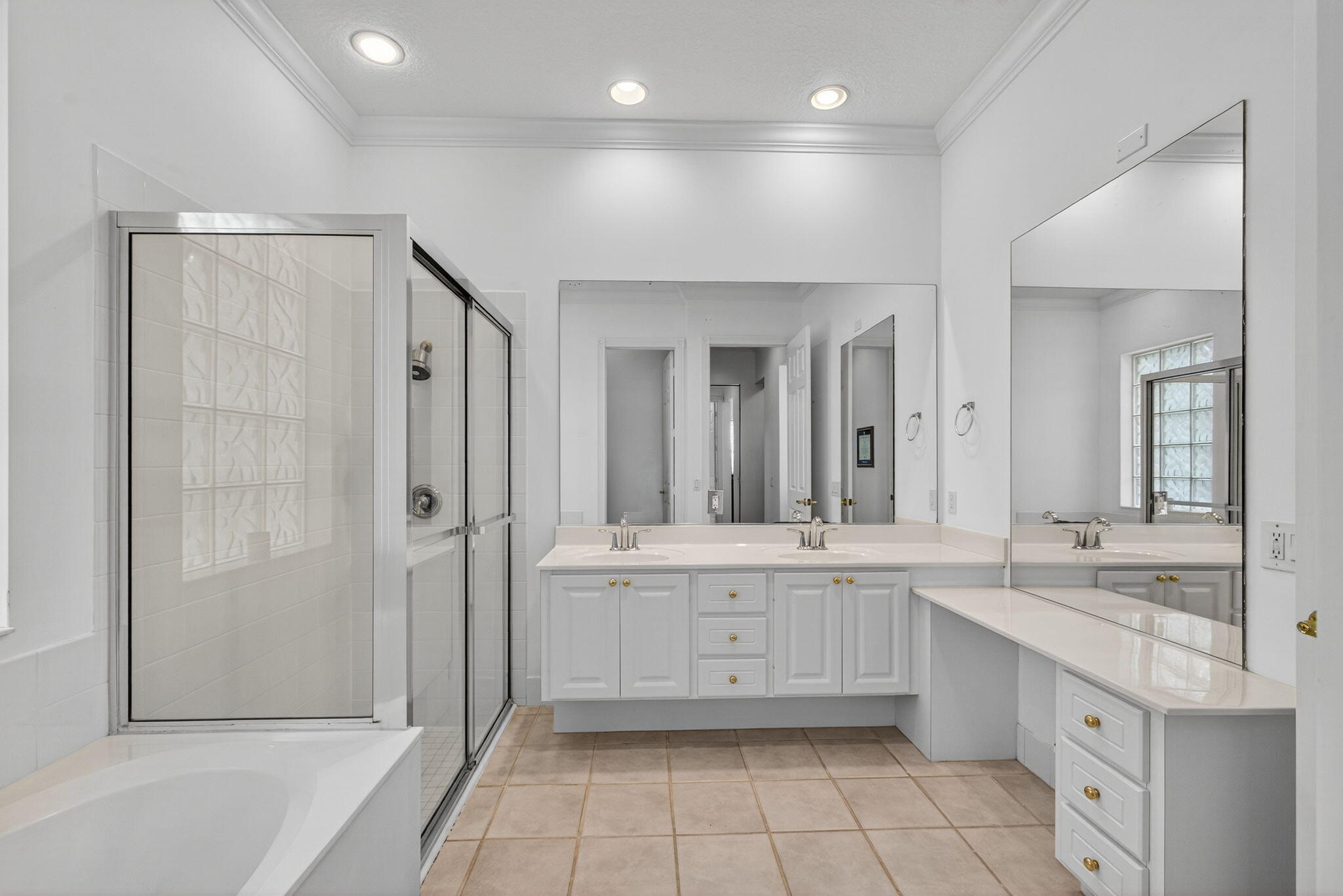 172 Queensland Lane Jupiter, FL 33458 - Photo 16 of 25 a large bathroom with a granite countertop sink mirror and bathtub