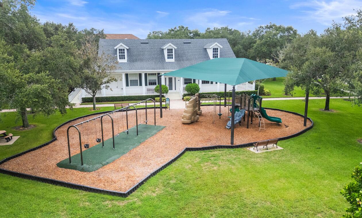 172 Queensland Lane Jupiter, FL 33458 - Photo 25 of 25 an aerial view of a house with garden and a patio