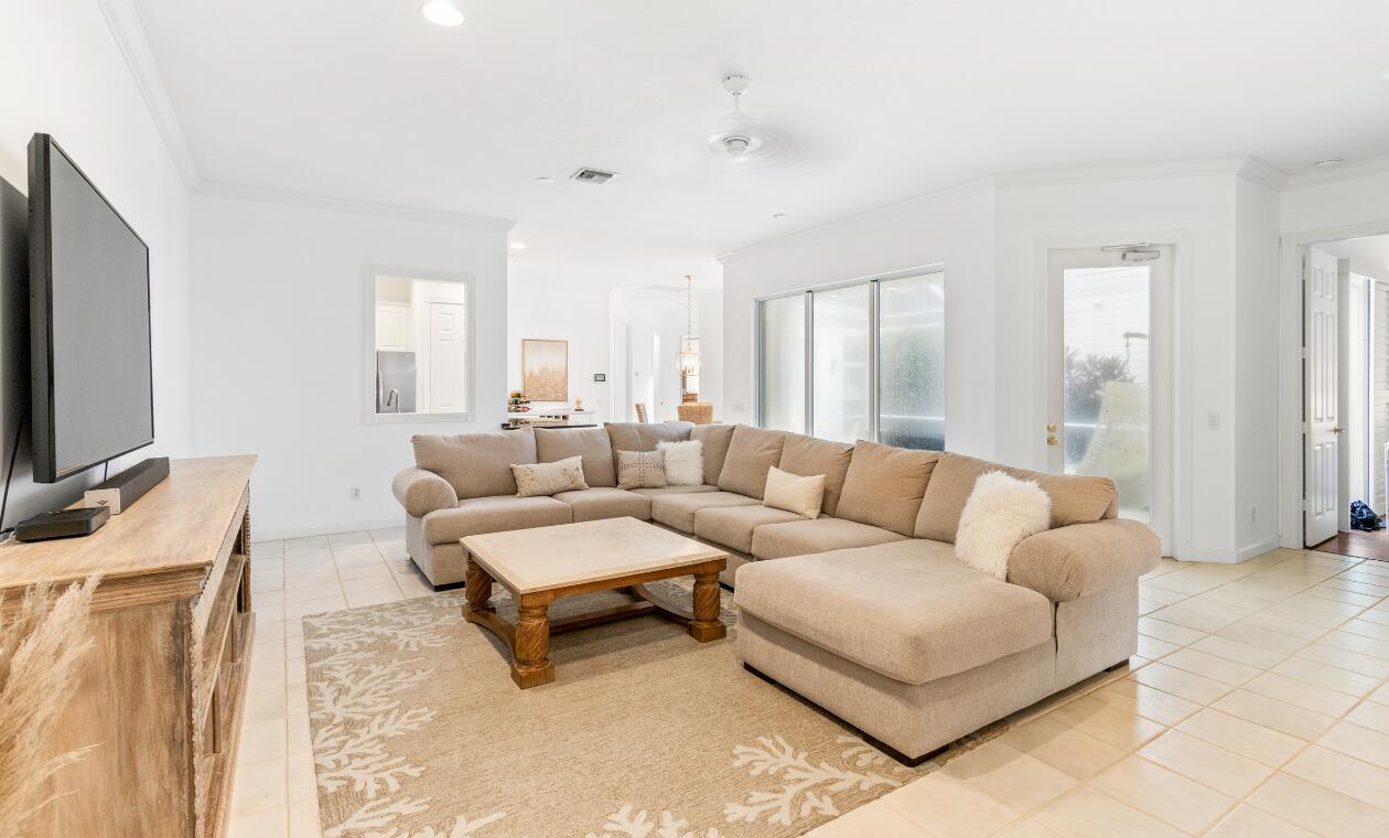 172 Queensland Lane Jupiter, FL 33458 - Photo 9 of 25 a living room with furniture and a flat screen tv