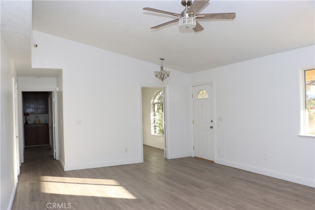 15742 Muscatel Street Hesperia, CA 92345 - Photo 4 of 24 a view of an entryway with wooden floor