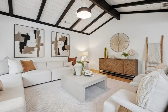 a bedroom with a large bed and a large window