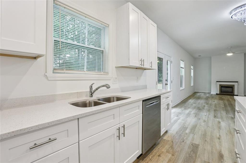 4405 Belcamp Road Fairburn, GA 30213 - Photo 15 of 60 a kitchen with a sink cabinets and window