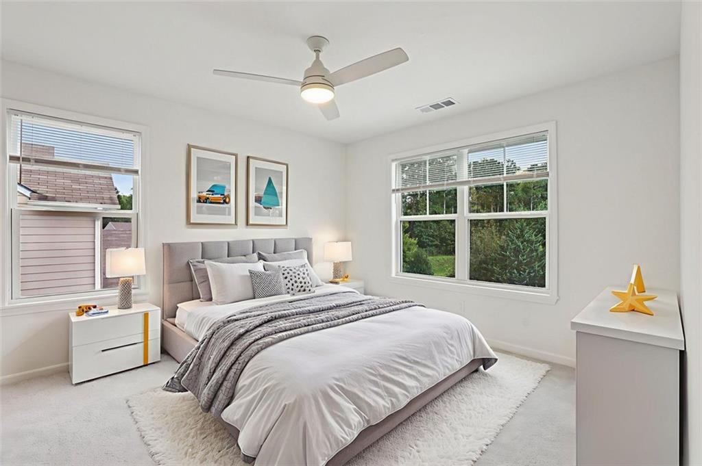 4405 Belcamp Road Fairburn, GA 30213 - Photo 25 of 60 a bedroom with a bed and a window