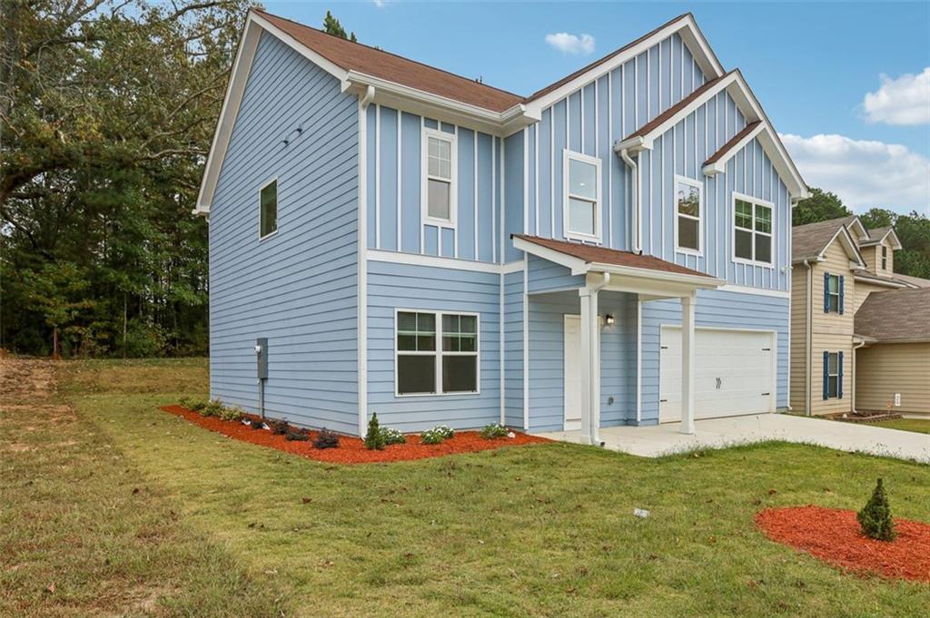 4405 Belcamp Road Fairburn, GA 30213 - Photo 3 of 60 a front view of a house with a yard