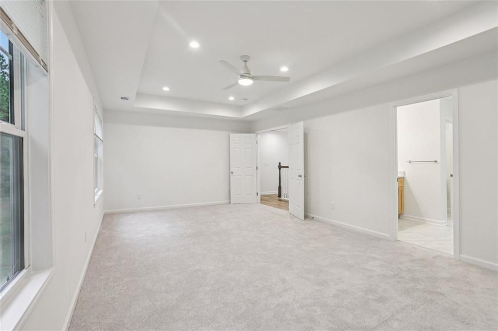 4405 Belcamp Road Fairburn, GA 30213 - Photo 36 of 60 an empty room with an entryway and fan