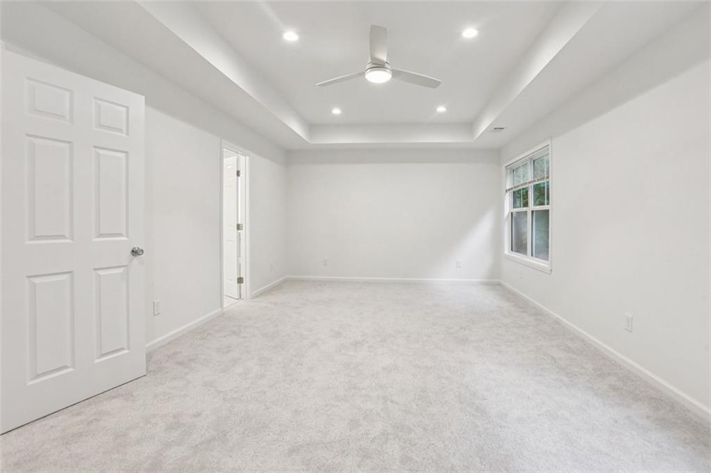 4405 Belcamp Road Fairburn, GA 30213 - Photo 39 of 60 an empty room with windows and closet