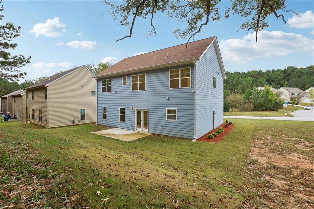 4405 Belcamp Road Fairburn, GA 30213 - Photo 47 of 60 a view of a house with backyard and garden